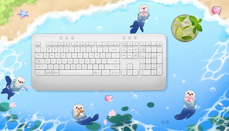 May include: A white wireless keyboard with a numeric keypad sits on a blue and white background with cartoon sea otters and a glass of lemonade. The background is reminiscent of a beach scene.
