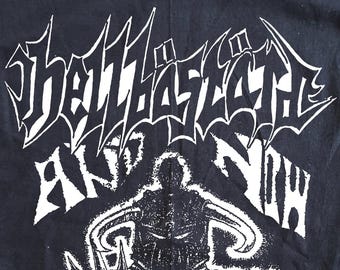 May include: A black short-sleeved t-shirt featuring a white graphic print. The design includes the text "Hellbastard" and "And Now" above an illustration of a figure in armour. Below the figure, the text reads "you have an appointment with Death... and you will attend".