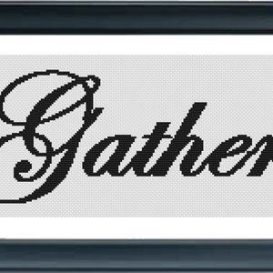 May include: A framed cross-stitch artwork with the word "Gather" in elegant black script. The text is centered on a white background and framed by a dark blue border. A decorative piece for home decor.
