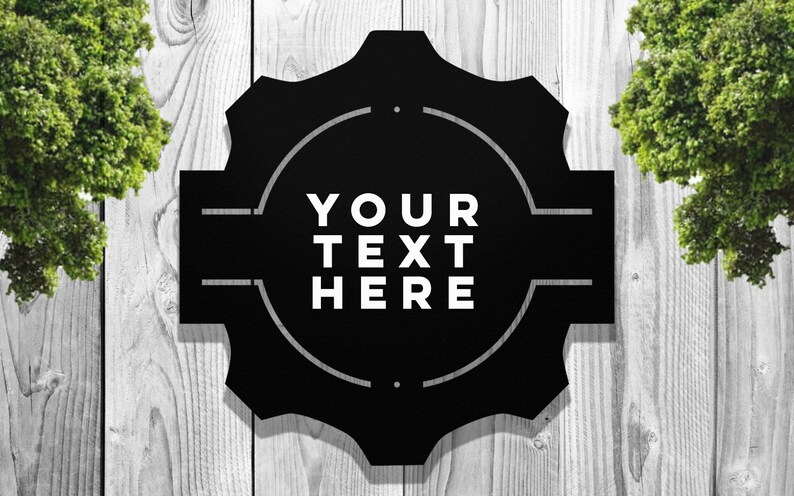 May include: Black metal sign with a circular design and the text "YOUR TEXT HERE" in white.