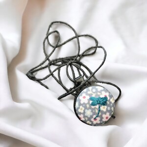 Embroidered necklace - firefly in meadow, miniature hoop, modern, one inch, redesign, repurposed fabric
