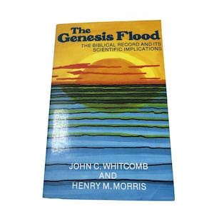 May include: A vintage book titled "The Genesis Flood" with a colorful cover. The cover features a sunset scene with orange, yellow, green, and blue hues. The book's title and author's names are printed in bold, dark blue and white text.