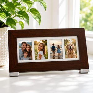 May include: A rectangular dark brown wooden photo frame with a white mount featuring four distinct apertures. The frame is supported by two silver-toned metal feet at the base and displays four separate photographs of people and a golden dog.
