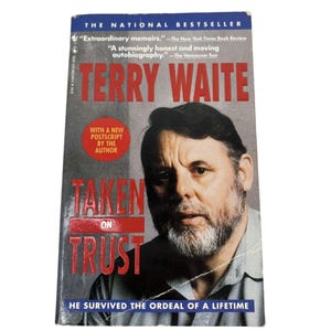 May include: A paperback book titled "Taken on Trust" by Terry Waite. The cover features a portrait of the author and the text "The National Bestseller." The book has a red and white title with the tagline "He survived the ordeal of a lifetime."