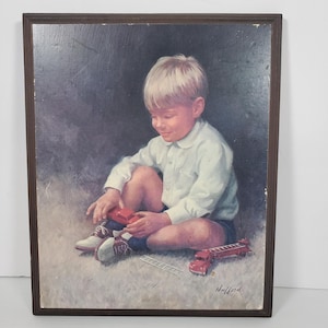 May include: A framed vintage print depicting a young child playing with toy fire engines and a ladder. The child is wearing a white shirt and blue shorts. The artwork is signed "Hufford" in the bottom right corner.