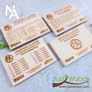 May include: Four wooden blocks with engraved text and logos for leatherworking tools. The blocks display information about stitch lengths and iron pulling techniques. The brand name "Armitage Leather" is visible, along with the text "Made in Britain."