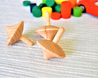 Natural wooden spinning tops, made from solid beech, FSC certified timber.