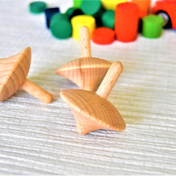 Natural wooden spinning tops, made from solid beech, FSC certified timber.