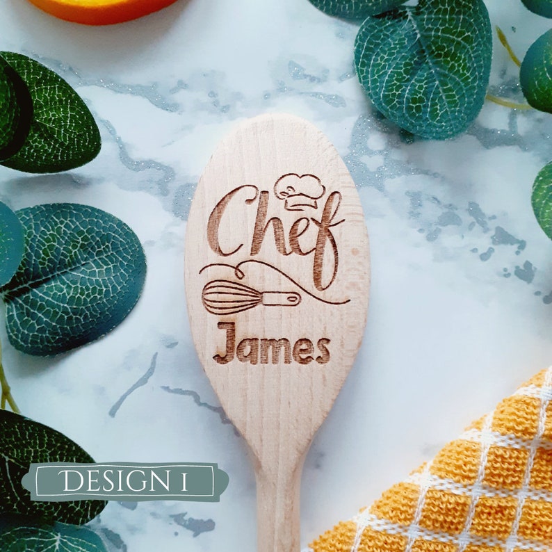 May include: Wooden spoon with the words "Chef James" engraved on it. The spoon has a small chef hat and whisk design.
