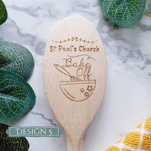May include: Wooden spoon with the text "St. Paul's Church Bake Off" engraved on it. The spoon has a design of a mixing bowl and whisk.