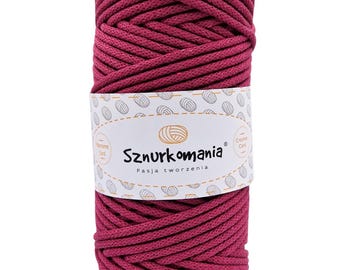 May include: A spool of deep pink cotton cord, labelled "Sznurkomania Pasja tworzenia" with a small logo of a ball of yarn.