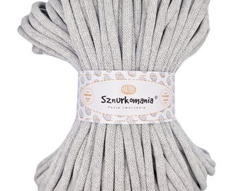 May include: A large roll of light gray cotton cord, perfect for crafting projects. The cord is made of 100% cotton and is soft and durable. The label on the cord reads "Sznurkomania Pasja tworzenia".