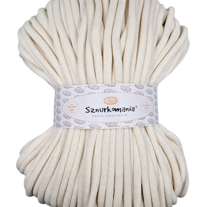 May include: A large spool of off-white cotton cord, perfect for crafting projects. The cord is made by Sznurkomania, a Polish company that specializes in crafting supplies.