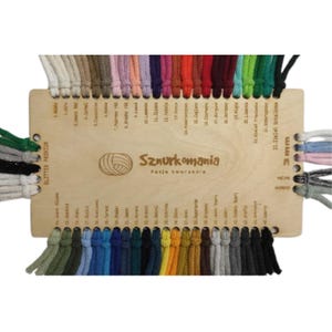 May include: A wooden color chart with a variety of cotton cord colors. The chart is labeled with numbers and color names in Polish. The chart is labeled "Sznurkomania Fasja Tworzenia" which translates to "Cord Mania Creation Passion".