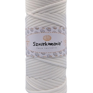May include: A white cotton cord, wound into a ball, with a label that reads "Sznurkomania Pasja tworzenia".