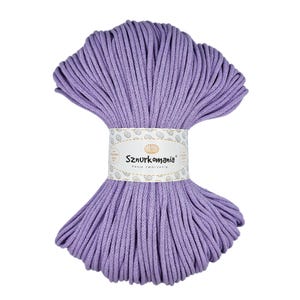 May include: A skein of lavender coloured cotton cord, wrapped in a spiral shape. The cord is labelled "Sznurkomania Pasja tworzenia".
