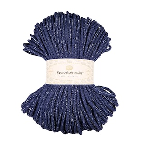 May include: A spool of navy blue cord with silver glitter thread. The cord is wrapped around a label that says "Sznurkomania" with the text "Pasja tworzenia" underneath.