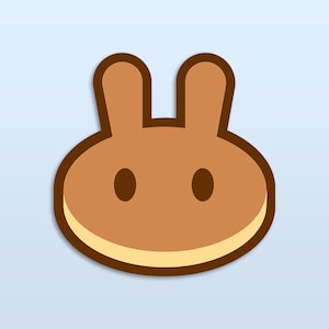 May include: A brown cartoon bunny face with large ears and two black eyes. The bunny face is outlined in brown and has a light brown inner circle.