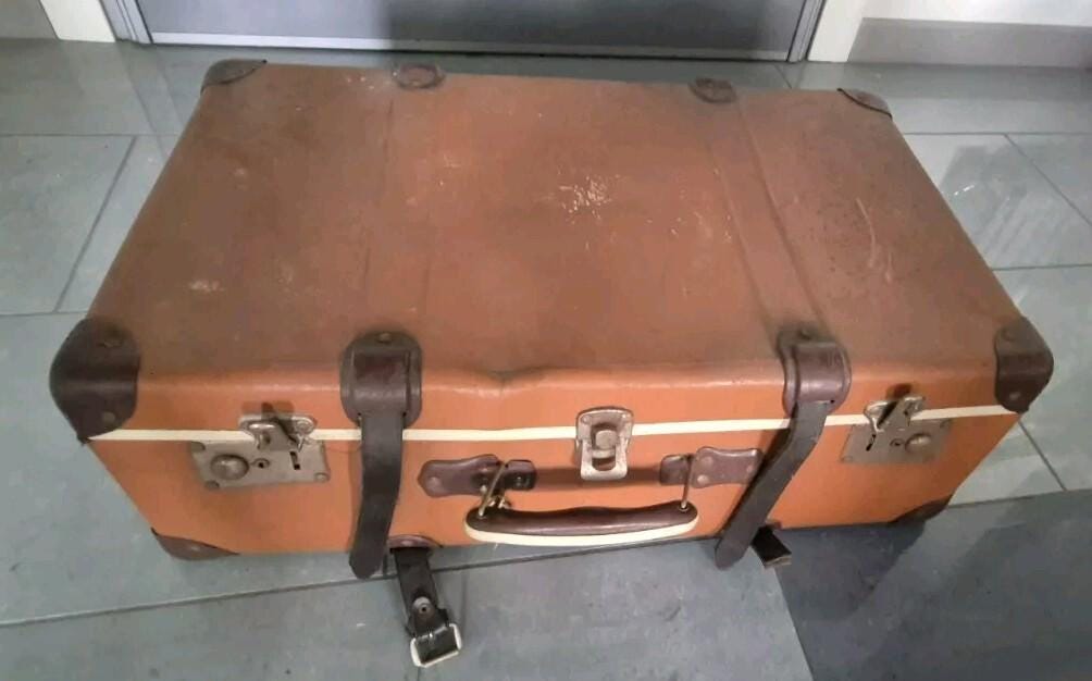 Beautiful vintage reinforced cardboard suitcase with metal and leather inserts