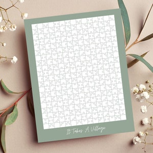 Puede incluir: Un rompecabezas blanco con un borde verde y el texto "It Takes A Village" en la parte inferior.