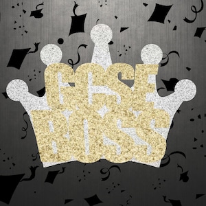 Pode incluir: Uma coroa de glitter dourado com as palavras "Best Boss" dentro. A coroa está sobre um fundo preto com confete preto.