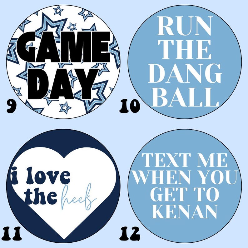 May include: Four blue and white round stickers with different designs and text. The first sticker has a white background with blue stars and the text "GAME DAY". The second sticker has a light blue background with white text that says "RUN THE DANG BALL". The third sticker has a dark blue background with a white heart and the text "i love the heef". The fourth sticker has a light blue background with white text that says "TEXT ME WHEN YOU GET TO KENAN".