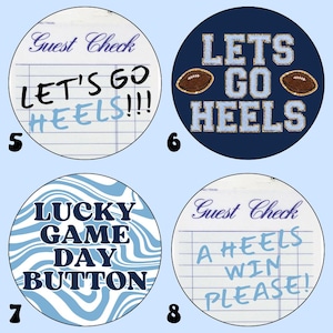 May include: Four round buttons with different designs. The first button is white with blue writing that says "Guest Check" and "Let's Go Heels!!!". The second button is blue with white writing that says "Let's Go Heels" and has two footballs. The third button is white and blue with a wavy pattern and the words "Lucky Game Day Button". The fourth button is white with blue writing that says "Guest Check" and "A Heels Win Please!".
