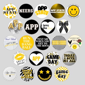 May include: A set of 20 round buttons with various designs related to App State University. The buttons feature black and yellow colours, with text such as "App State", "Game Day", "Run the Dang Ball", and "Lucky Me! I'm a Mountaineer".