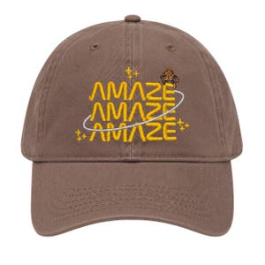 May include: A brown baseball cap featuring yellow embroidered text that reads AMAZE stacked three times. A thin white circular line orbits the text, accompanied by small yellow star icons and a small brown turtle graphic above the text.