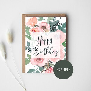 May include: A white card with a watercolor floral design in shades of pink and green. The card says "Happy Birthday" in black script.