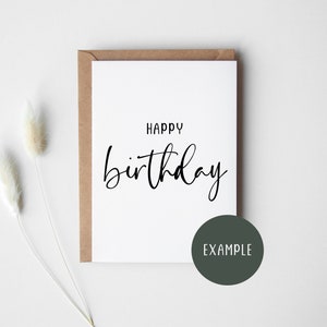 May include: A white card with a black handwritten message that says "Happy birthday". The card is on a brown envelope and a white background.