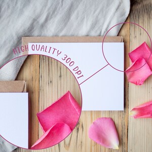 May include: A blank white card with a brown envelope on a wooden surface. The card is surrounded by pink rose petals. The text "HIGH QUALITY 300 DPI" is written in a circle around the card.
