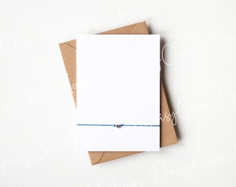 PSD Smart Object Layer and JPEG Digital Mock-up Download Blue Wish Bracelet Card Mockup With Heart Bead