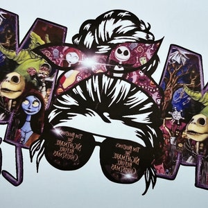 May include: A black and white illustration of a woman with a messy bun and sunglasses. The background is filled with characters from the movie "The Nightmare Before Christmas". The text "Mom Life" is written in purple below the illustration.
