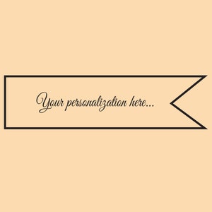 May include: A black banner with a pointed end on the right side. The banner has the text "Your personalization here..." in a cursive font.