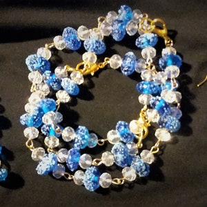 Beautiful unique Blue Glass Beads in drop earrings and set of 3 bracelets.