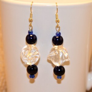 Dark blue and clear glass beaded drop earrings.