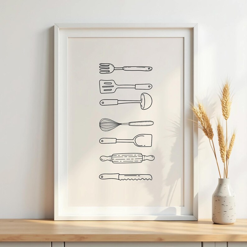 May include: A framed print featuring line drawings of kitchen utensils, including a fork, spatula, ladle, whisk, turner, rolling pin, and knife. The black and white illustrations are arranged vertically on a cream-colored background.