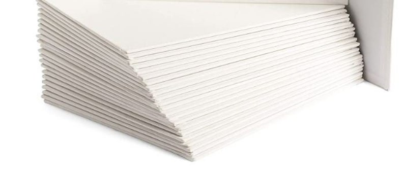 May include: A stack of white paper sheets, likely for drawing or crafting.