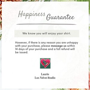 May include: Happiness Guarantee text with a pink heart graphic and the text "Laurie Lux Velvet Studio". The text reads: "We know you will enjoy your shirt. However, if there is any reason you are unhappy with your purchase, please message us within 14 days of your purchase and a full refund will be issued."