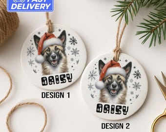 May include: Two white ceramic Christmas ornaments featuring a dog wearing a Santa hat. The dog's name, "DAISY", is printed below the image. Design 1 and Design 2 are labeled below each ornament. Snowflakes are printed around the dog's head.
