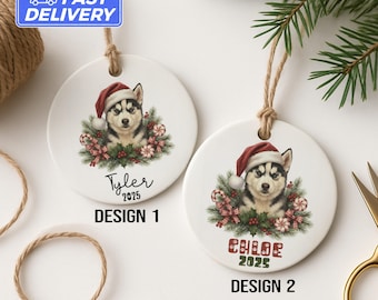 May include: Two white ceramic Christmas ornaments featuring a husky wearing a Santa hat, surrounded by festive greenery and candy canes. One ornament says "Tyler 2025" and the other says "Chloe 2025". Both have a twine loop for hanging.