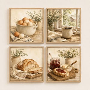 May include: A set of four square framed wall art prints featuring rustic kitchen scenes. The images depict a bowl of eggs, a steaming mug by a window, a loaf of bread on a wooden board, and a slice of toast with jam and butter on a cutting board.