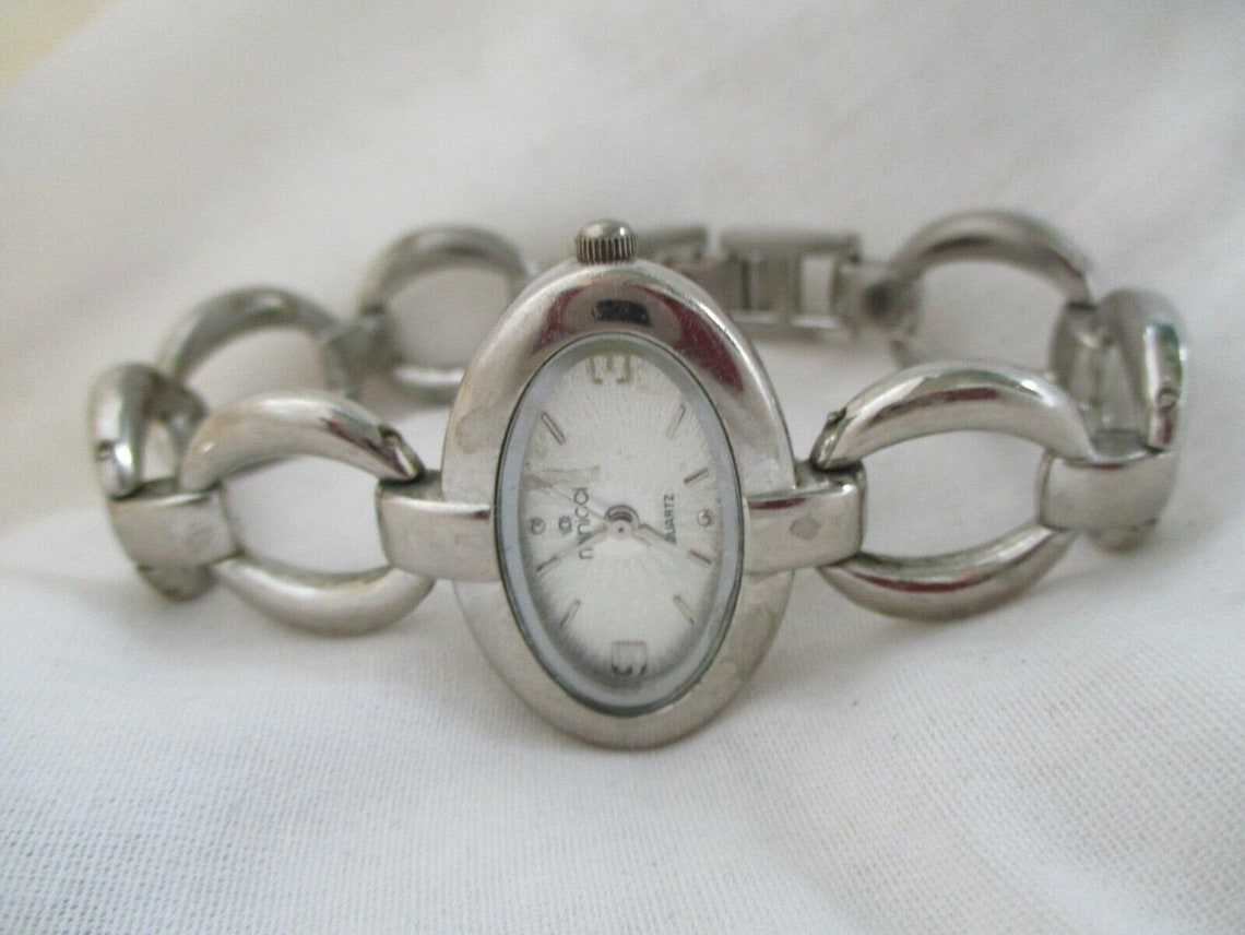 Minicci Watch Silver Toned Oval Shaped Face Bracelet Band | Etsy