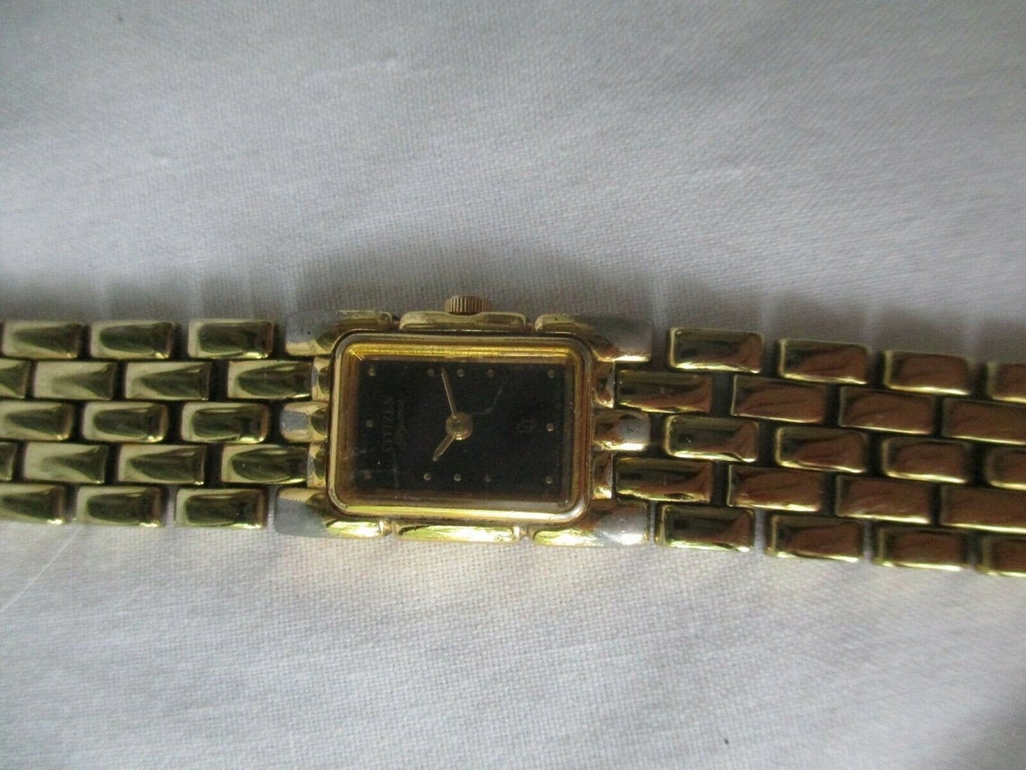 citizen gold watch black face