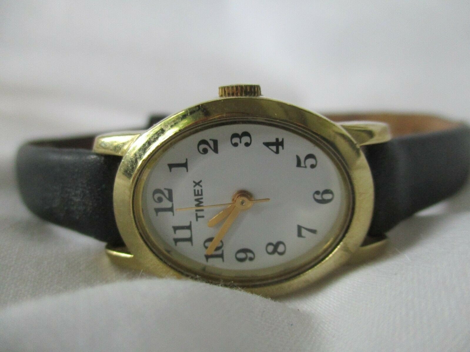 Timex Watch Gold Toned Oval Shaped Face Black Leather Band Etsy