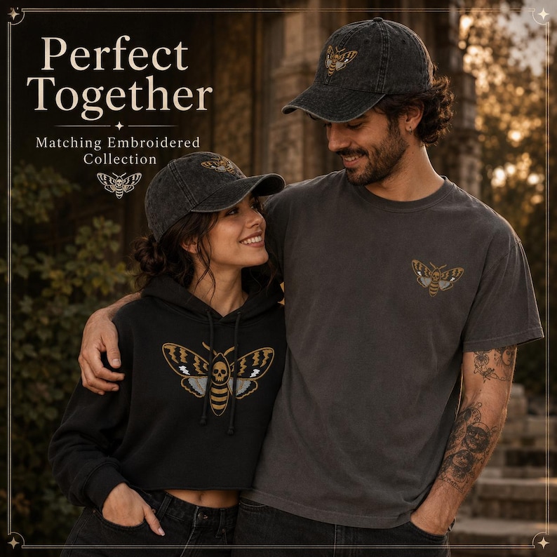 May include: A charcoal gray baseball cap, a black hooded sweatshirt, and a charcoal gray t-shirt, each featuring an embroidered moth design with a skull pattern. The text Perfect Together Matching Embroidered Collection is visible.