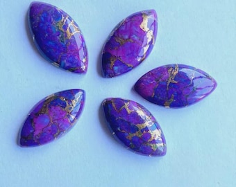 May include: Five marquise-shaped gemstones with a vibrant purple hue, accented by gold veining. The polished stones are arranged in a starburst pattern against a light blue background, showcasing their unique color and texture.