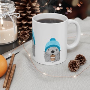 Let's Stay Warm Two-Otter Coffee Mug by Lillian IpKoon