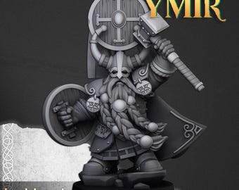 May include: A gray miniature figurine of a bearded warrior wearing a horned helmet, holding a round shield and a large hammer. The figure features braided hair and detailed armor. Text on the image reads JUNE RELEASE, SONS OF YMIR, and HIGHLANDS MINIATURES.